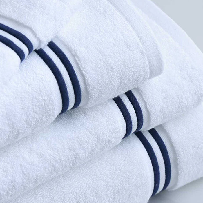 Empire Face Towel White Navy folded neatly on a light gray surface