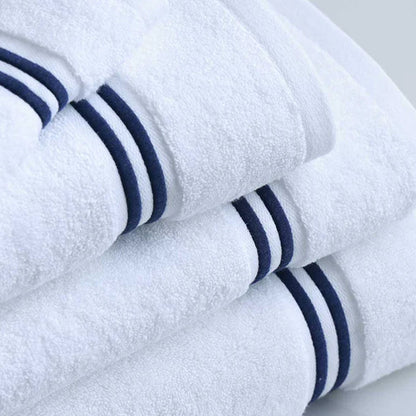 Empire Face Towel White Navy folded neatly on a light gray surface