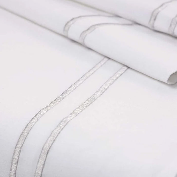 Close-up of Empire Silver Flat Sheet on a light gray background