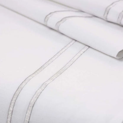 Close-up of Empire Silver Flat Sheet on a light gray background