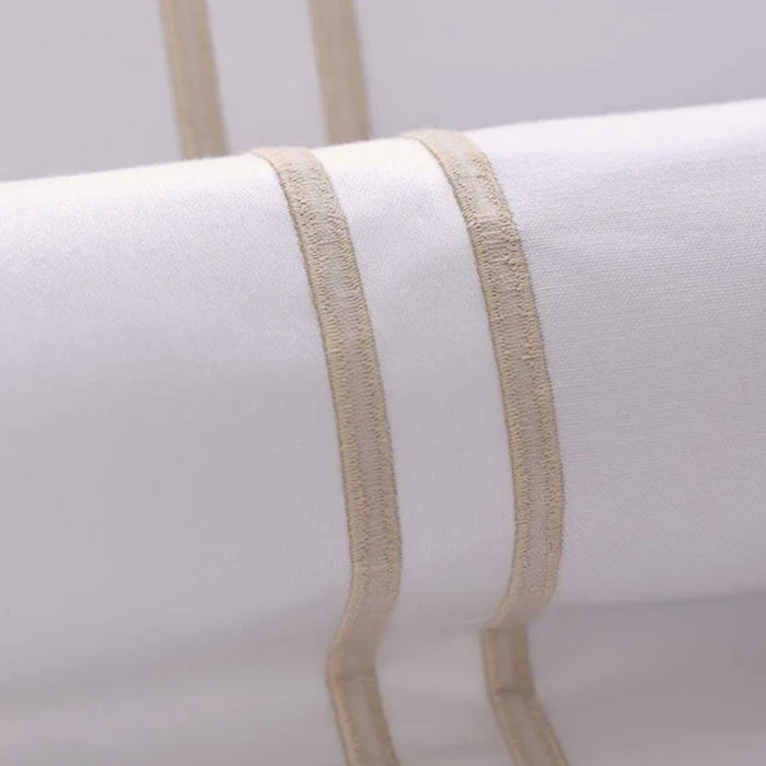 Close-up of Empire Champagne Flat Sheet on a light gray background