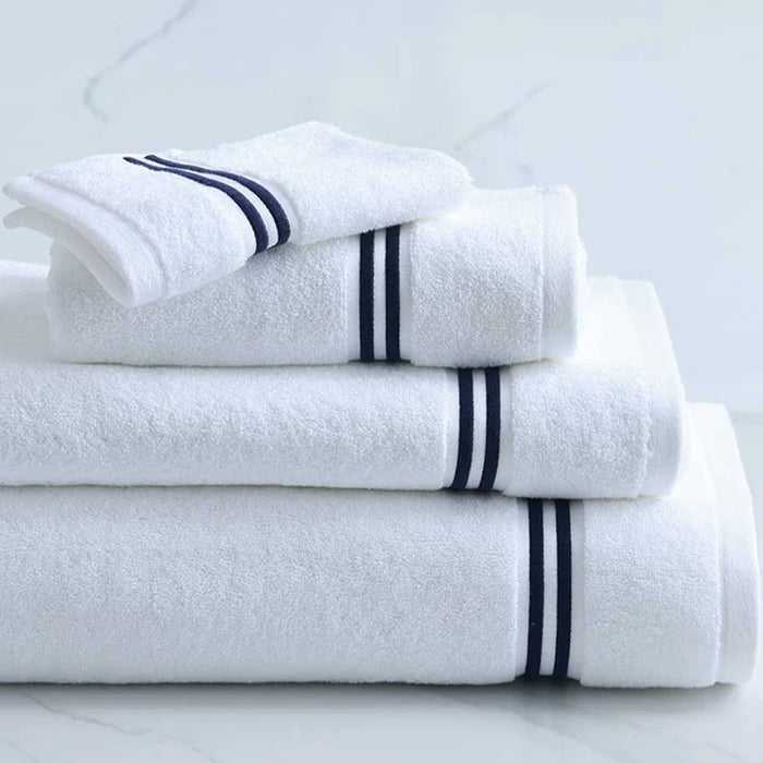 Stack of Empire Hand Towel White Navy on a light gray background