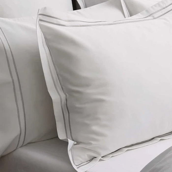 Close-up of Empire Silver Pillowcases on a bed
