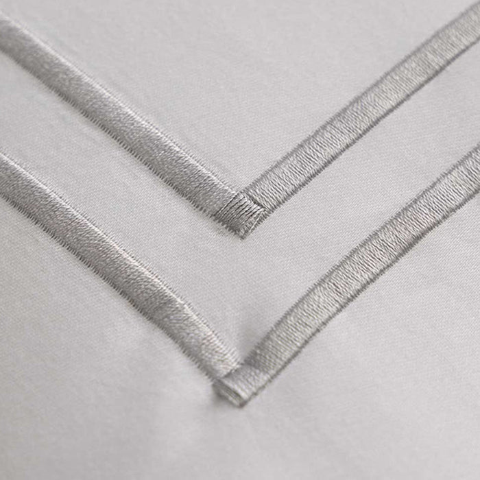 Close-up of Empire Silver Pillowcase on a light gray background