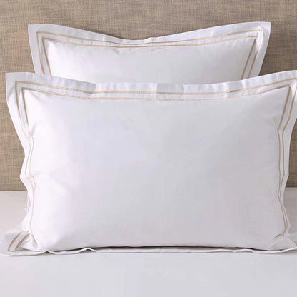 Empire Champagne Pillowcases on a neutral background