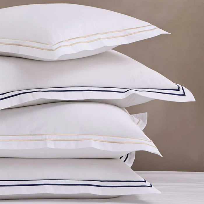 Stack of Empire Champagne Pillowcase on a neutral background