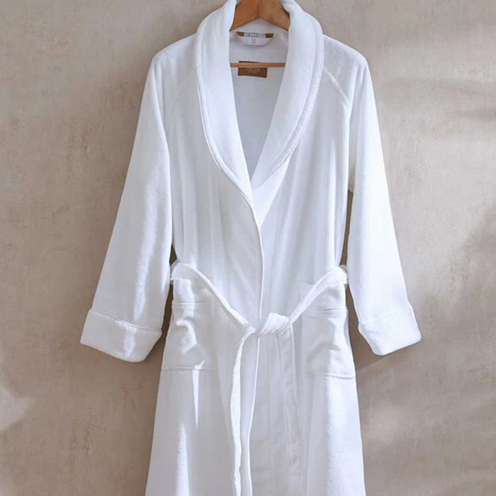 Empire Velour White / White Bath robeon a hanger against a beige background