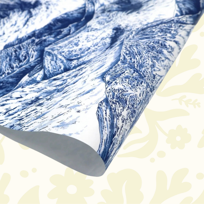 Forager Provisions LTD gift wrapping paper featuring a detailed blue and white mountain landscape illustration