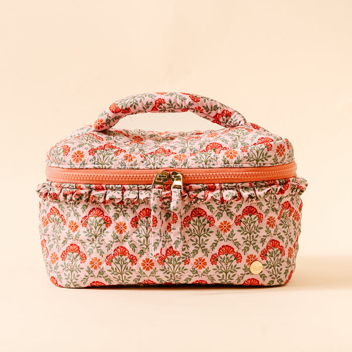 The Darling Effect Everbloom Dusty Rose Glam & Go Quilted Cosmetic Bag features a pink quilted design with red and green floral print, coral zipper and trim. Stylish, water-resistant—perfect for travel.