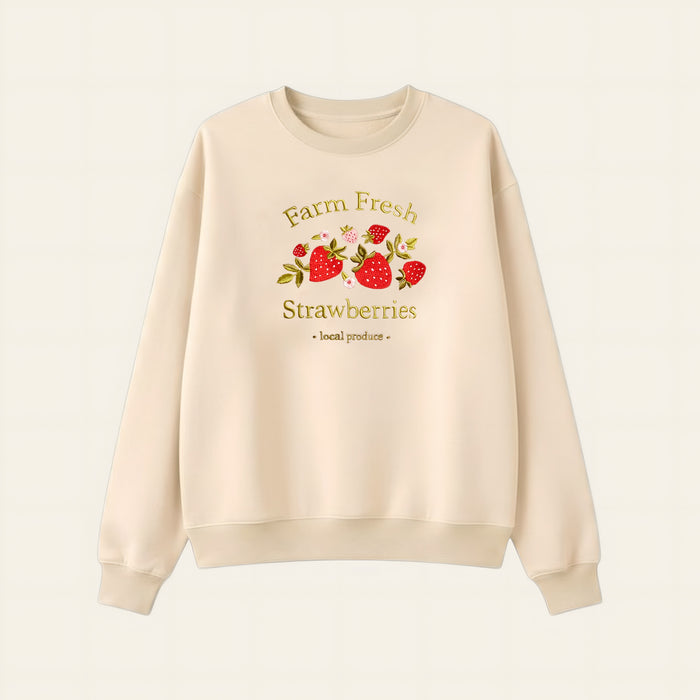 The Darling Effect’s Farm Fresh Strawberries Signature Crew is a cream sweatshirt with embroidered strawberries and “Farm Fresh Strawberries - local produce,” designed for all-day comfort and a timeless look.