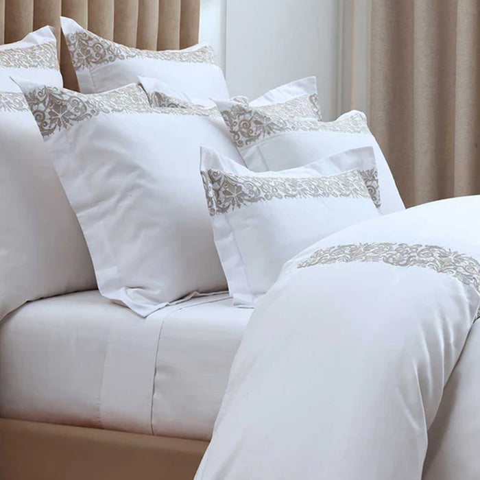 Fion Taupe Duvet Cover Set on a bed.