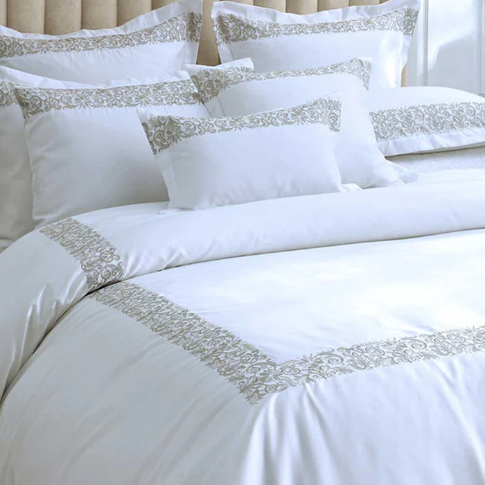 Fion Taupe Duvet Cover Set on a bed.