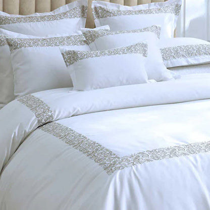 Fion Taupe Duvet Cover Set on a bed.