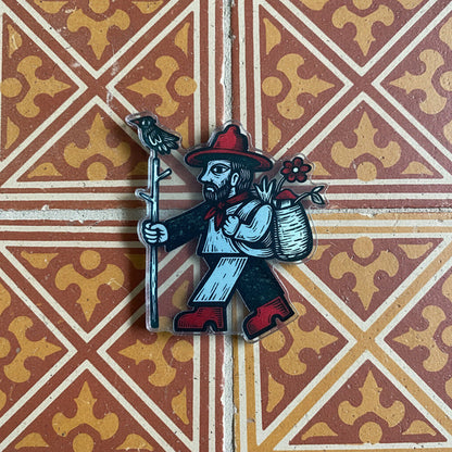 Forager Provisions LTD medieval acrylic magnet featuring a folk-art style traveler with a staff and bird.