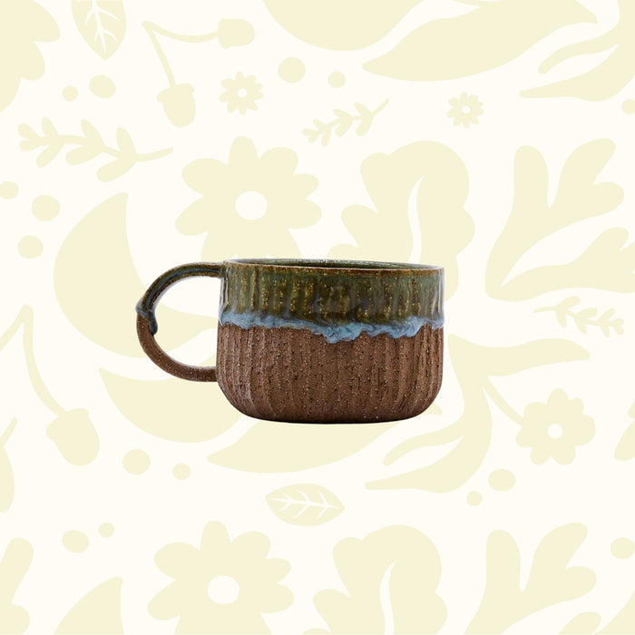 Forager Provisions LTD Ribera Bluverde Arte handmade stoneware mug with a textured brown base and green glazed rim.