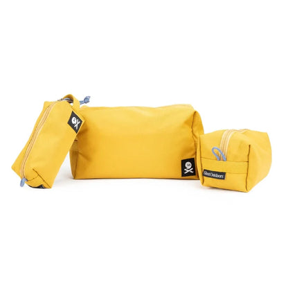 Three Ghost Outdoors Ochre Yellow Dopp Kits displayed side by side on white background, premium travel toiletry bags.