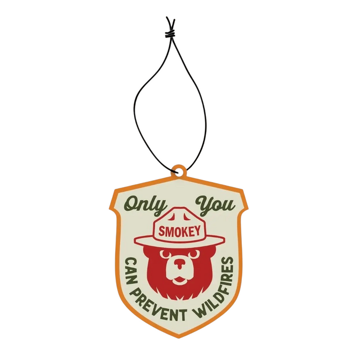 Good & Well Supply Co Smokey Bear Pine & Sage badge air freshener with “Only You Can Prevent Wildfires” slogan.