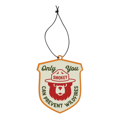 Good & Well Supply Co Smokey Bear Pine & Sage badge air freshener with “Only You Can Prevent Wildfires” slogan.