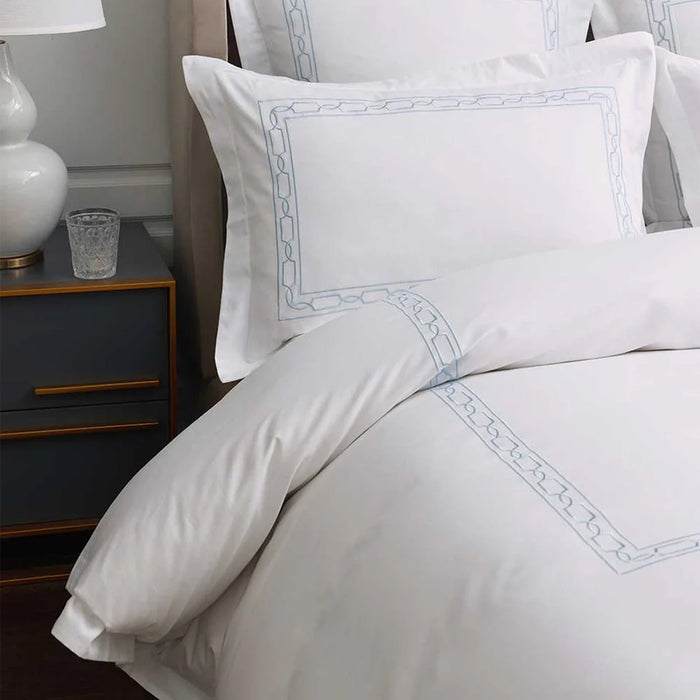 Hamilton Light Blue Duvet Cover Set on a bed in a bedroom setting.