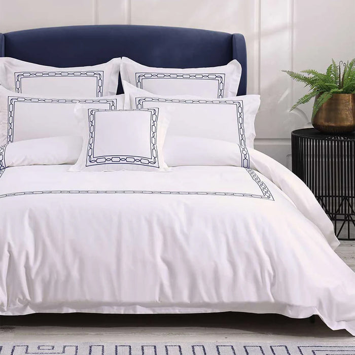 Hamilton Navy Duvet Cover Set on a bed in a bedroom setting.
