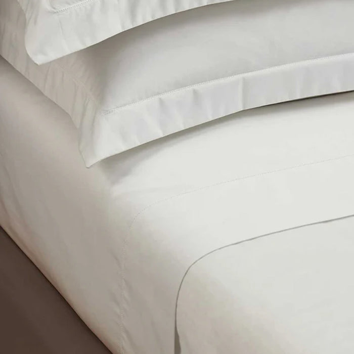 Close-up of Heirloom Picot Stitch Ivory Flat Sheet on a neutral background