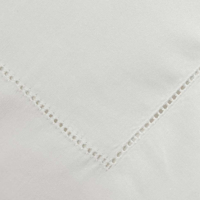Close-up of Heirloom Picot Stitch Ivory Flat Sheet on a white background