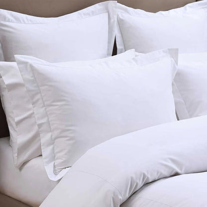 Heirloom Picot Stitch White Pillowcase on a bed