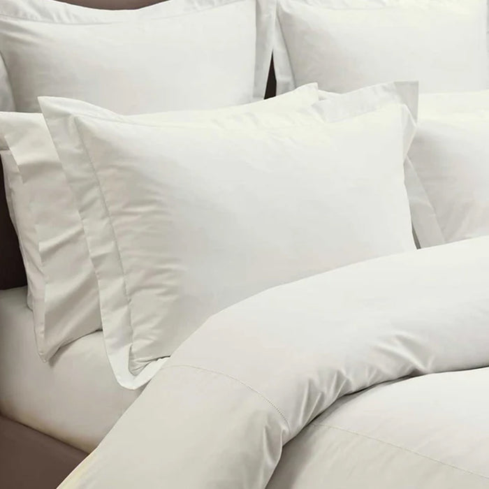 Heirloom Picot Stitch Ivory Pillowcase on a bed
