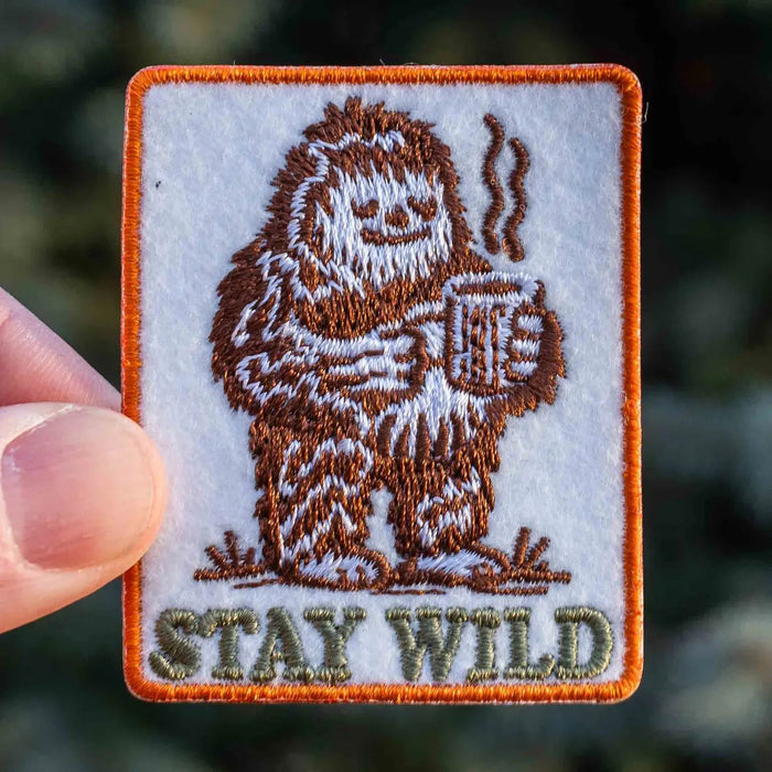 Forager Provisions LTD embroidered iron-on patch featuring a brown Bigfoot holding a steaming coffee mug.