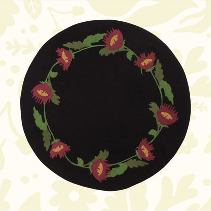 Primitive Folk Flowers In Firkin mat with black, red flowers and green leaves—perfect rustic cottagecore decor by The Home Collection.