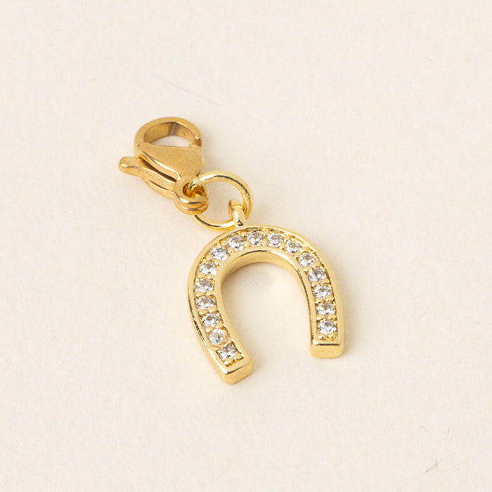 Horseshoe Jewelry Charm Gold by the-darling-effect: gold-toned with pave-set clear crystals and a lobster clasp—ideal for charm bars or mixing with other unique jewelry charms.