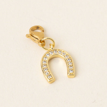 Horseshoe Jewelry Charm Gold by the-darling-effect: gold-toned with pave-set clear crystals and a lobster clasp—ideal for charm bars or mixing with other unique jewelry charms.