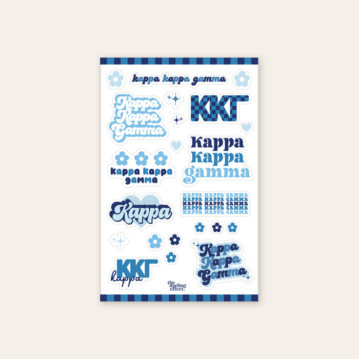 The Darling Effect’s Kappa Kappa Gamma Sticker Sheet features blue, white, and navy stickers with Kappa Kappa Gamma in different fonts, plus flowers, hearts, and stripes—perfect for showing off your sisterhood pride.