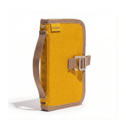 Forager Provisions LTD Lochby Mini Field Journal in mustard waxed canvas with a side handle and metal buckle closure.