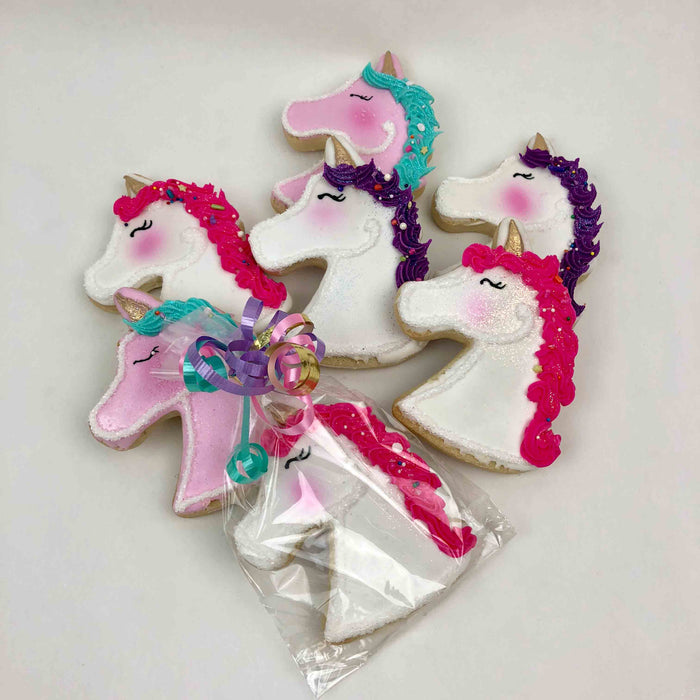 Pink and white Unicorn Cookies with pink, purple, and turquoise color mane options