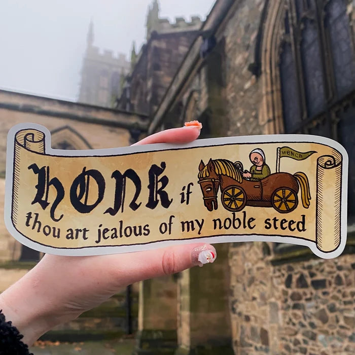 Hand holding Forager Provisions sticker, Medieval & Folklore Gift Set, with “Honk if thou art jealous” funny quote.
