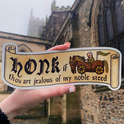 Hand holding Forager Provisions sticker, Medieval & Folklore Gift Set, with “Honk if thou art jealous” funny quote.