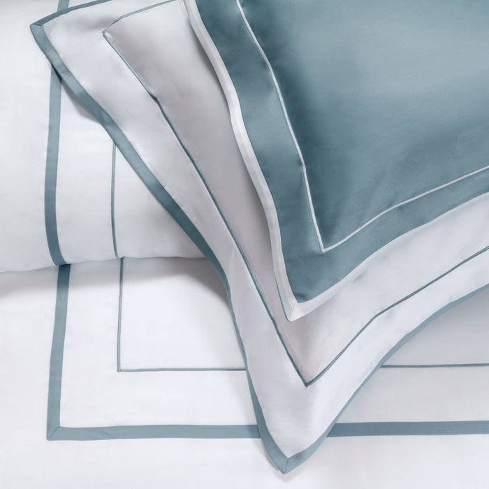 Mietta aquamarine and white pillowcase sham on a white background