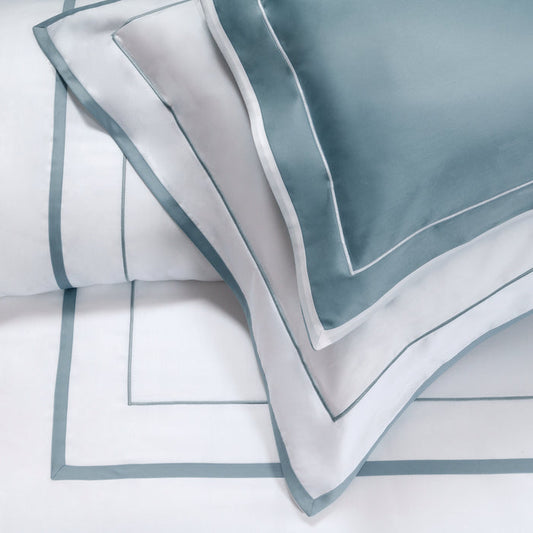 Mietta aquamarine and white pillowcase sham on a white background