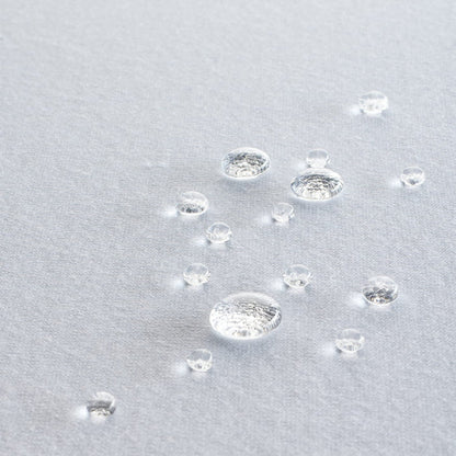 Nature Tencel Pillow Protector for tex blanca showing droplets of water on fabric