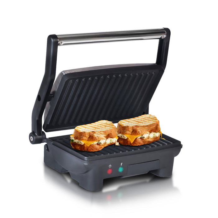 Nonstick Electric Panini Grill. Open position and toasting panini sandwiches.