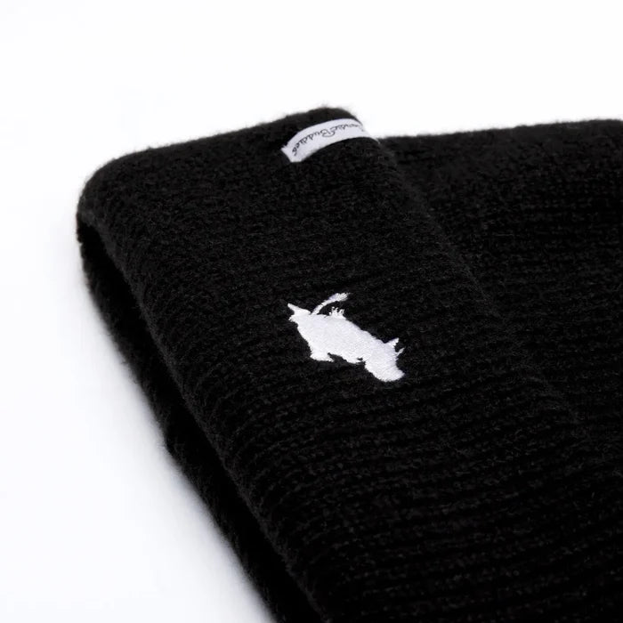 Shop Black Nordicbuddies Moomin beanie with white embroidered logo and fabric tag, top trendy winter hat accessory.