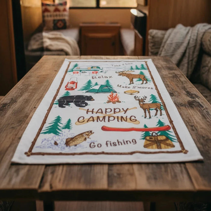 Forager Provisions LTD PAINES Happy Camping cotton kitchen tea towel with outdoor woodland illustrations on a wood table