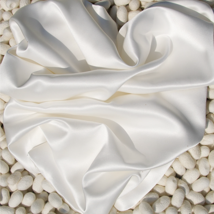 silkow Pillowcase S22 100% Pure Silk Satin With Narrow Edge on a background of silk yarns