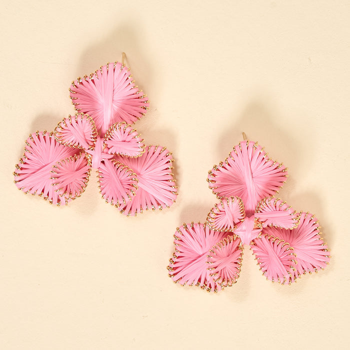 The Darling Effect's Pink Main Character Earrings are lightweight, three-petaled flower earrings with gold detailing—perfect for daily wear and shown on a beige background.