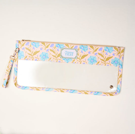 The Darling Effect’s Poppin' Petals Aqua Mahjong Tile Keeper Pouch features a pastel floral design, clear bottom window, top zipper, and wrist strap—perfect for stylish Mahjong tile storage or organizing game nights.