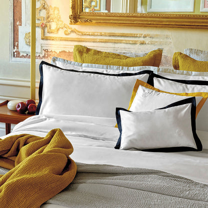 Prado midnight pillowcase sham on a bed in a bedroom setting.