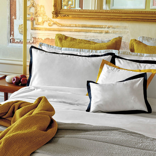 Prado midnight pillowcase sham on a bed in a bedroom setting.