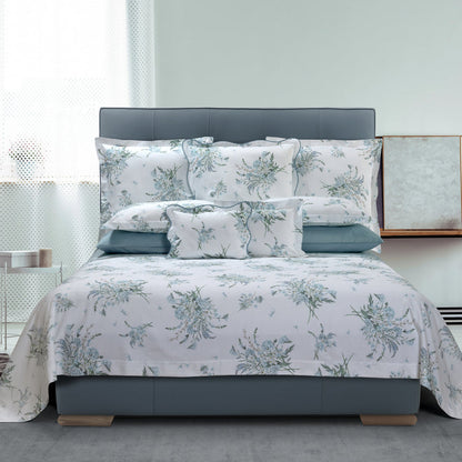 Profumi pillowcase sham and duvet cover on a bed with a gray headboard in a bedroom setting.