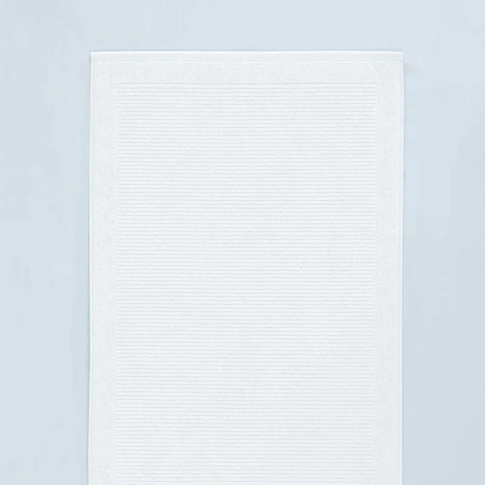 Renew Bath Mat White on a light gray background